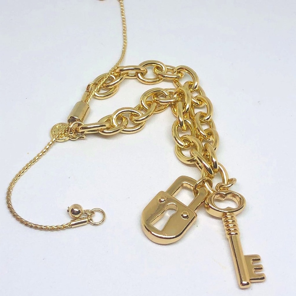 Gold Tone Bolo Bracelet With Lock And Key Charms